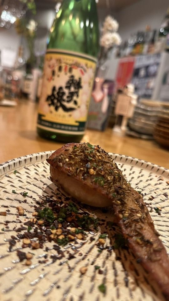 A 10-course meal with sake pairings in a bar atmosphere