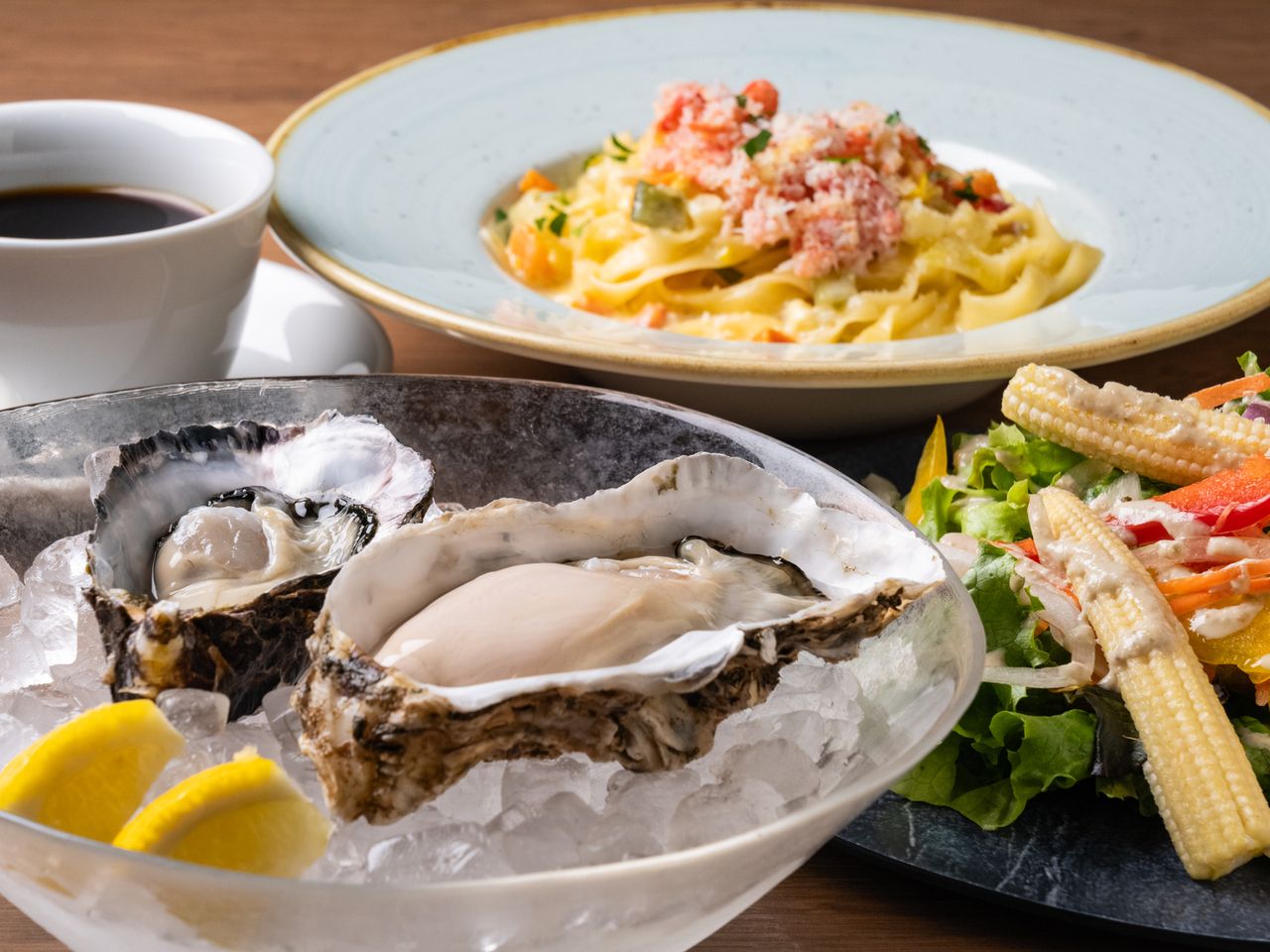 Tasting comparison of raw oysters, grilled oysters, and a choice of pasta - 5 dishes in total