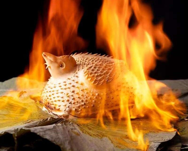 Reservation-only menu item: "Dong'an Chicken style, wrapped in lotus leaves and grilled."